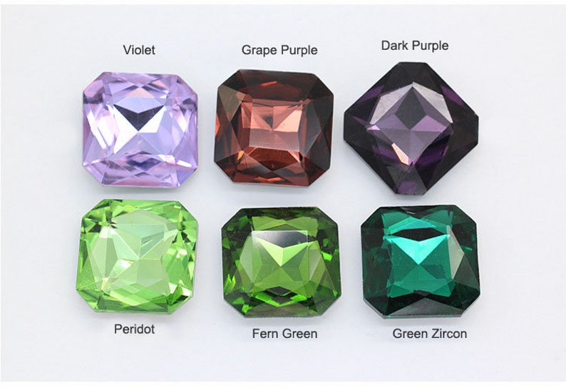 May include: Six square-shaped gemstones in different colors: violet, grape purple, dark purple, peridot, fern green, and green zircon.