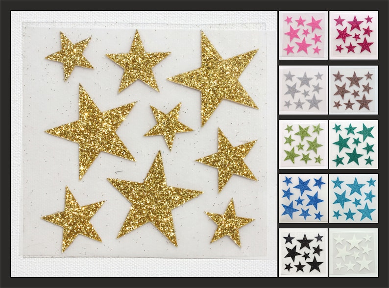 Op de afbeelding: Een vel met gouden glitterster stickers. Het vel is verdeeld in 12 secties, elk met een andere kleur glitterster stickers. De kleuren omvatten roze, rood, zilver, bruin, groen, teal, blauw, zwart en wit.