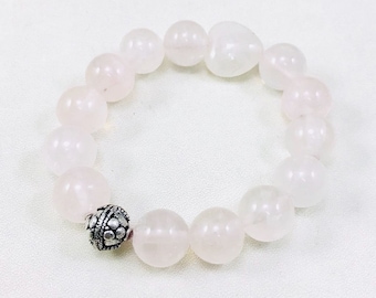 24A) Beautiful Inner Peace Rose Quartz Bracelet with a Bali bead. Bead size 12mm. Bracelet size 15cms.