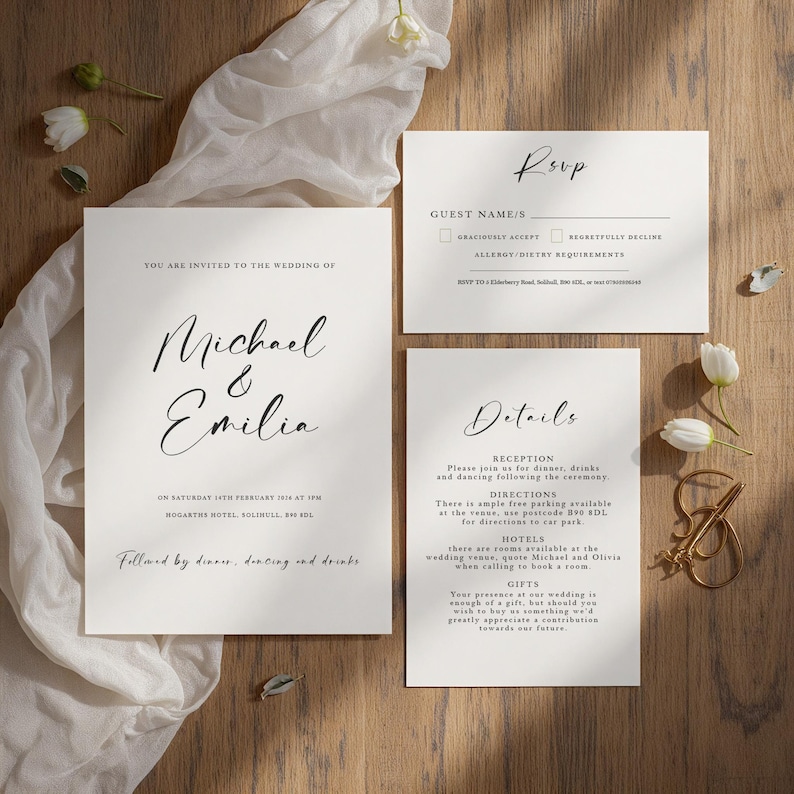 May include: Elegant wedding invitation suite featuring a main invitation, RSVP card, and details card. The cards are white with black calligraphy text, including the names "Michael & Emilia". The suite is arranged on a wooden surface with floral accents.