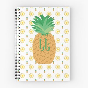 May include: A yellow pineapple with green leaves and the word "Zola" written on it. The background is white with a repeating pattern of yellow pineapples.