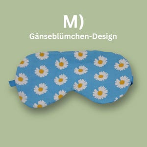Könnte beinhalten: Eine blaue Schlafmaske mit einem weißen Gänseblümchenmuster. Die Maske hat elastische Bänder und steht oben "M) Gänseblümchen-Design".