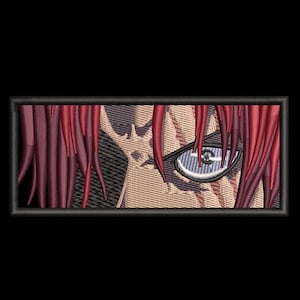 May include: Embroidered patch featuring a detailed anime-style eye with a reflective lens and red hair. The patch is rectangular with a black border, set against a black background. The eye is a focal point.