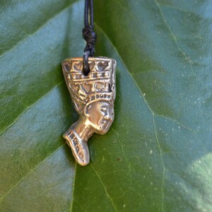 Nefertiti Egyptian Queen is depicted in bronze in this handcrafted pendant