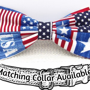 May include: A red, white, and blue bow tie with a patchwork design featuring the American flag and stars. The bow tie has the word "USA" printed on it. The text "Matching Collar Available!" is printed on a black and white illustration of a dog collar.