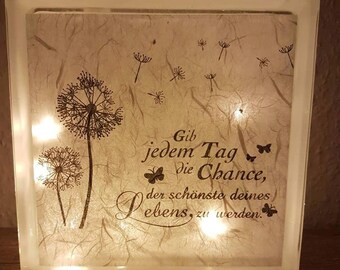 Glass block illuminated with saying "Give every day a chance"