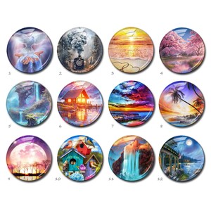 May include: A set of twelve circular glass cabochons, each with a different landscape scene. The designs include a dove, a train, sunsets, waterfalls, a cabin, and a birdhouse. The cabochons are in various colours.