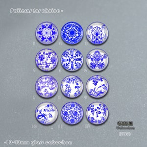 May include: Twelve round glass cabochons with blue and white patterns. The cabochons are 10mm in diameter and are arranged in a grid pattern. The patterns are inspired by traditional Chinese porcelain.