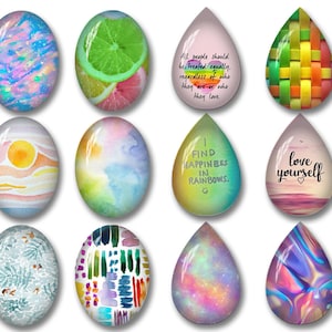 May include: A collection of twelve glass cabochons in oval and teardrop shapes featuring diverse designs including watercolor washes, citrus slices, woven patterns, galaxy prints, and text reading All people should be treated equally, I find happiness in rainbows, and love yourself.