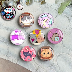 May include: Set of ten round glass cabochons with colorful cat designs. The cabochons feature various cat illustrations, including a cat wearing a witch hat, a cat with a heart, and a cat in a box. The cabochons are perfect for crafting projects, such as jewelry making, scrapbooking, and resin art.