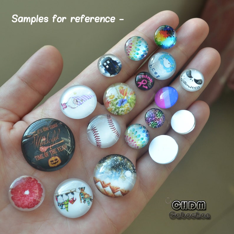 May include: A collection of round glass cabochons with various designs, including a baseball, floral patterns, and a Jack Skellington face. Some cabochons have text, including "it's the most wonderful time of the year". The text "Samples for reference" is also visible.