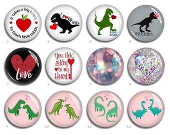 May include: A collection of twelve round, glass-covered buttons with various designs. The buttons feature images of dinosaurs, hearts, and text like "Love Bites" and "I Roar You." Colors include red, green, black, and pink, with glitter accents.