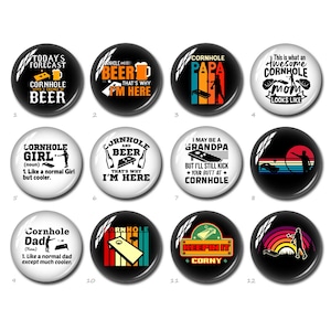May include: A collection of twelve round, glossy buttons with various designs related to the game of cornhole. The buttons feature text and graphics, including phrases like "Cornhole Papa," "Keepin' it Corny," and "Cornhole Girl." The color palette includes black, white, red, and orange.