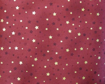 Red Star Fabric with Gold Metallic Accents for Quilting, Apparel, Home Decor, and Crafting Projects