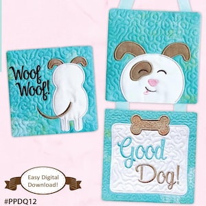 May include: Three turquoise blue quilted squares with embroidered dog designs. The top square features a white dog with brown ears and a pink nose. The middle square has a white dog with brown ears and the text "Woof Woof!" The bottom square has a bone and the text "Good Dog!"