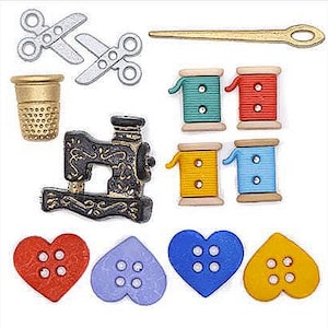 May include: A collection of sewing-themed embellishments, including silver scissors, a gold thimble, and colorful spools of thread. There are also heart-shaped and other shaped buttons in various colors, and a decorative sewing machine.