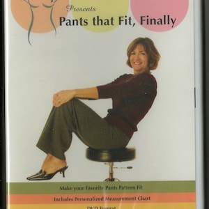 May include: DVD cover featuring a woman sitting on a stool, wearing a maroon sweater and green pants. The cover is titled "Hip Line Media Presents Pants that Fit, Finally." The text also states "Make your Favorite Pants Pattern Fit" and "Includes Personalized Measurement Chart".