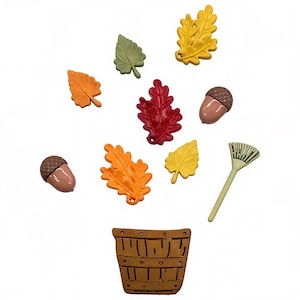 May include: A collection of fall-themed decorative elements, including colorful leaves in shades of orange, yellow, red, and green, along with two acorns and a small rake. A brown basket is at the bottom. These items are perfect for autumn crafts.