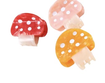 Pinza para el cabello con forma de hongo de acetato: una pinza para el cabello llamativa y grande.