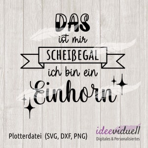 Könnte beinhalten: Schwarzer Text auf hellem Holzmaserungshintergrund. Der Text lautet "DAS ist mir SCHEIBEGAL ich bin ein Einhorn" mit Sternakzenten. Darunter steht "Plotterdatei (SVG, DXF, PNG)" und "ideeviduell Digitales & Personalisiertes".