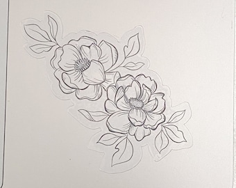 May include: A black and white line drawing of a floral bouquet with three flowers and leaves on a silver laptop.