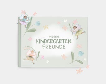 May include: A light green book cover with the German text "Meine Kindergarten Freunde" surrounded by illustrations of fairies and flowers in pastel colors. The cover features a whimsical design with a soft, dreamy aesthetic.