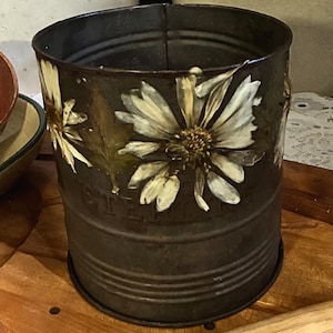 May include: A set of three ceramic mugs with a speckled, matte finish. The mugs are in shades of cream, light gray, and dark gray. Each mug has a simple, minimalist design, perfect for coffee or tea.