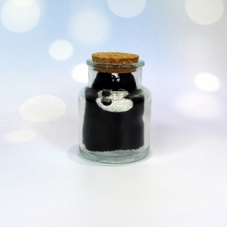 Little Demon keychain with bottle