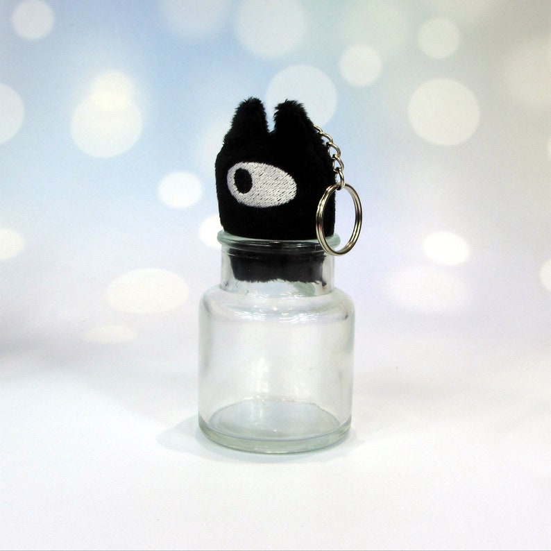 Little Demon keychain with bottle