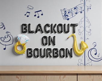 May include: A wall decorated with black balloon letters spelling "BLACKOUT ON BOURBON". A gold balloon saxophone and a diamond ring balloon are also present. Blue musical notes and decorative swirls complete the scene.
