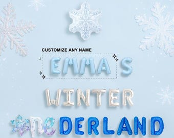 May include: Light blue, silver, and dark blue letter-shaped balloons spelling EMMA'S WINTER WONDERLAND on a light blue background. The display includes a snowflake-shaped balloon and decorative snowflake graphics with the text CUSTOMIZE ANY NAME.