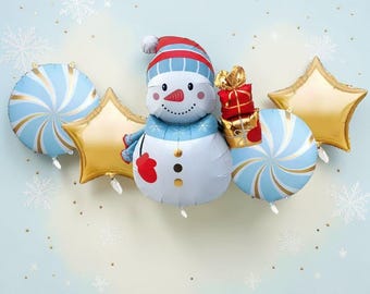 May include: A collection of foil balloons featuring a central snowman wearing a blue and red hat, holding a stack of red and gold gift boxes. The set includes two gold star-shaped balloons and two light blue and white swirl patterned round balloons.