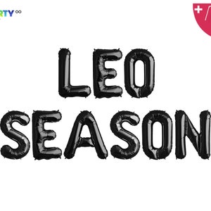 May include: Black foil balloon letters spelling "LEO SEASON" on a white background. The balloons are inflated and arranged in two rows. Includes a balloon straw and string.
