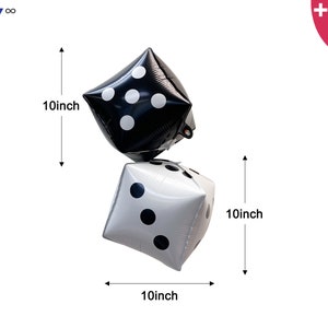 May include: Two 10-inch square foil balloons shaped like dice, one black with white dots and one white with black dots. Includes one balloon straw and one balloon string. The text PARTY infinity is visible in the top left corner.
