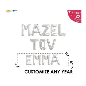 May include: Silver foil balloon letters spelling "MAZEL TOV EMMA" with the text "CUSTOMIZE ANY YEAR" below. The image includes a balloon straw and string. The Party logo is in the upper left corner.