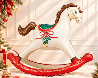 May include: An inflatable rocking horse balloon featuring a white body with a brown mane and tail. The horse has a green saddle decorated with a red ribbon and holly leaves. The curved rockers are bright red with gold filigree patterns.