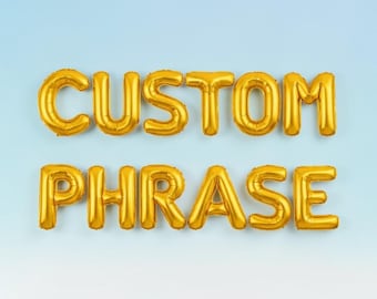 Guirnalda de letras de globos personalizadas: Globos con frases personalizadas en letras doradas para decoración de fiestas.