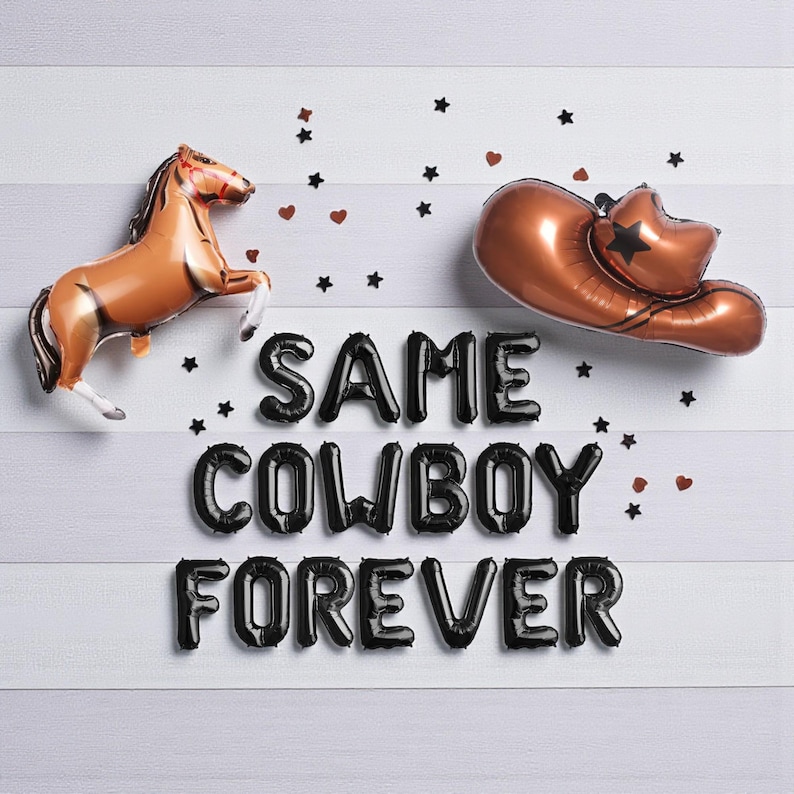 May include: A brown horse and a copper-colored cowboy hat balloon are displayed with black balloon letters that spell "SAME COWBOY FOREVER". Black star and heart confetti are scattered on a white wooden background.