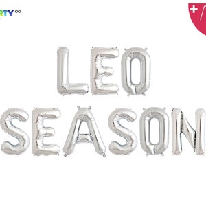 May include: Silver foil balloons spelling out "LEO SEASON" against a white background. The balloons are inflated and arranged in two rows. The top row spells "LEO" and the bottom row spells "SEASON". Includes a balloon straw and string.