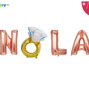 May include: Rose gold foil balloons spelling "HOLA" with a diamond ring balloon. The ring is gold with a white and blue diamond. Includes a balloon straw and string. PartyEight.com logo in the top left corner.