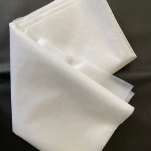 White Fusible UF363 Midweight Interfacing (36"X 60") . Nonwoven