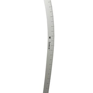 May include: A silver-colored, curved ruler with black markings and numbers. The ruler is marked with inches up to 24 inches. The brand name "M LANCE" is printed on the ruler. A small metal piece is attached to the top.