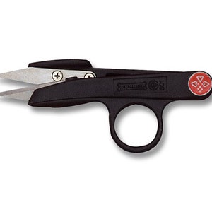 May include: Black embroidery scissors with a ring handle and a red clover symbol on the side. The scissors have a silver blade and a small screw on the side.