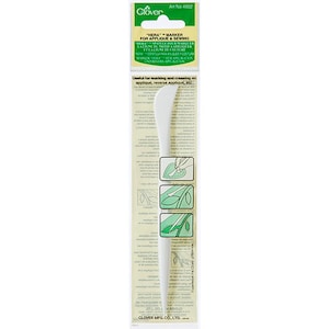 May include: White plastic tool with a pointed tip, labeled "Hera Marker for Applique & Sewing". The tool is used for marking and creasing on applique, reverse applique, etc.