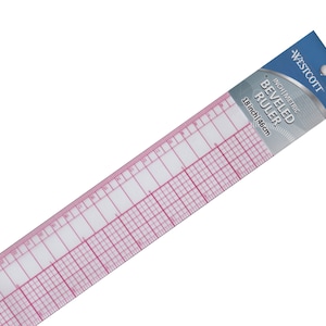 May include: An 18-inch beveled ruler with inch and metric markings. The ruler is clear with pink lines and is packaged in a blue and white wrapper with the Westcott brand name.