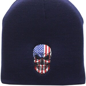 May include: Navy blue beanie with a skull graphic featuring the American flag.