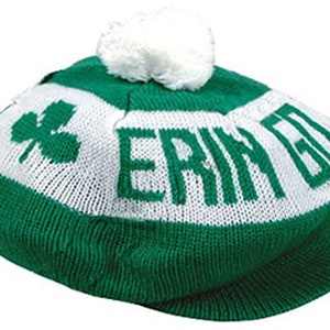 May include: Green and white knit beanie with a white pom pom on top. The beanie has the words "Erin Go Bragh" knitted into the white stripe.