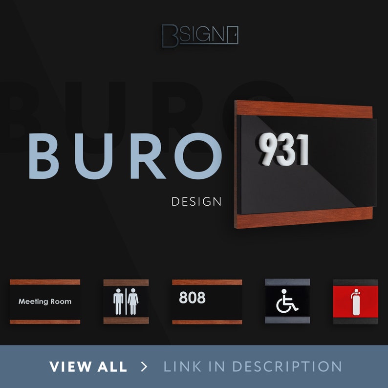 May include: A wooden sign with a black background and white text that reads "BURO DESIGN" and "931". The sign is mounted on a wall.