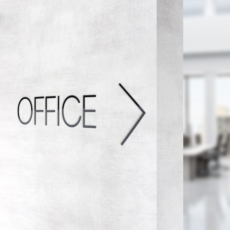 May include: A white wall with the word "OFFICE" and a black arrow pointing to the right.