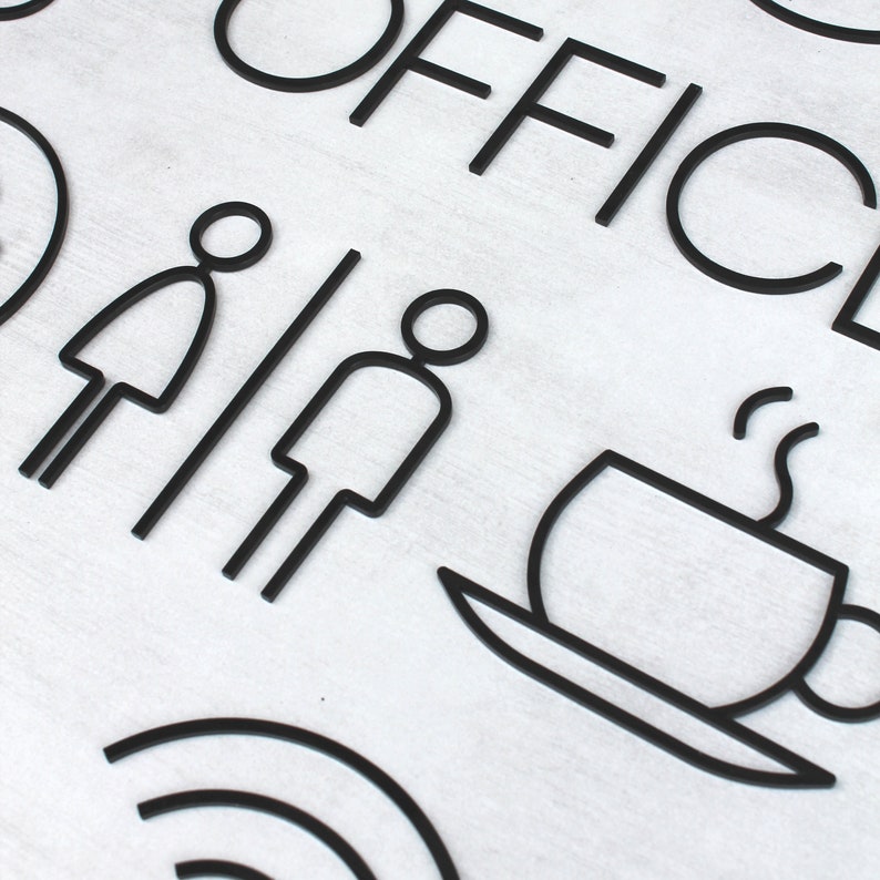 May include: Black and white sign with the word "OFFICE" in large letters. The sign also includes icons for restrooms, coffee, and wifi.